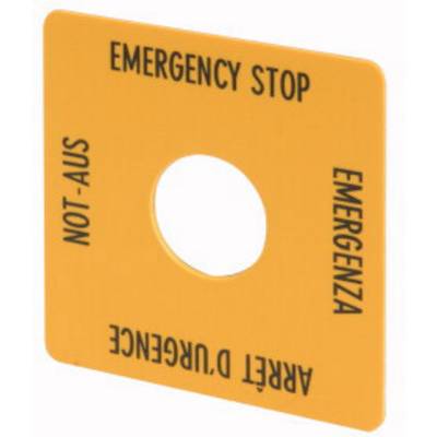 Coperchio arancione con un foro al centro, etichettato con 'EMERGENCY STOP' e traduzioni in tedesco, italiano e francese.
