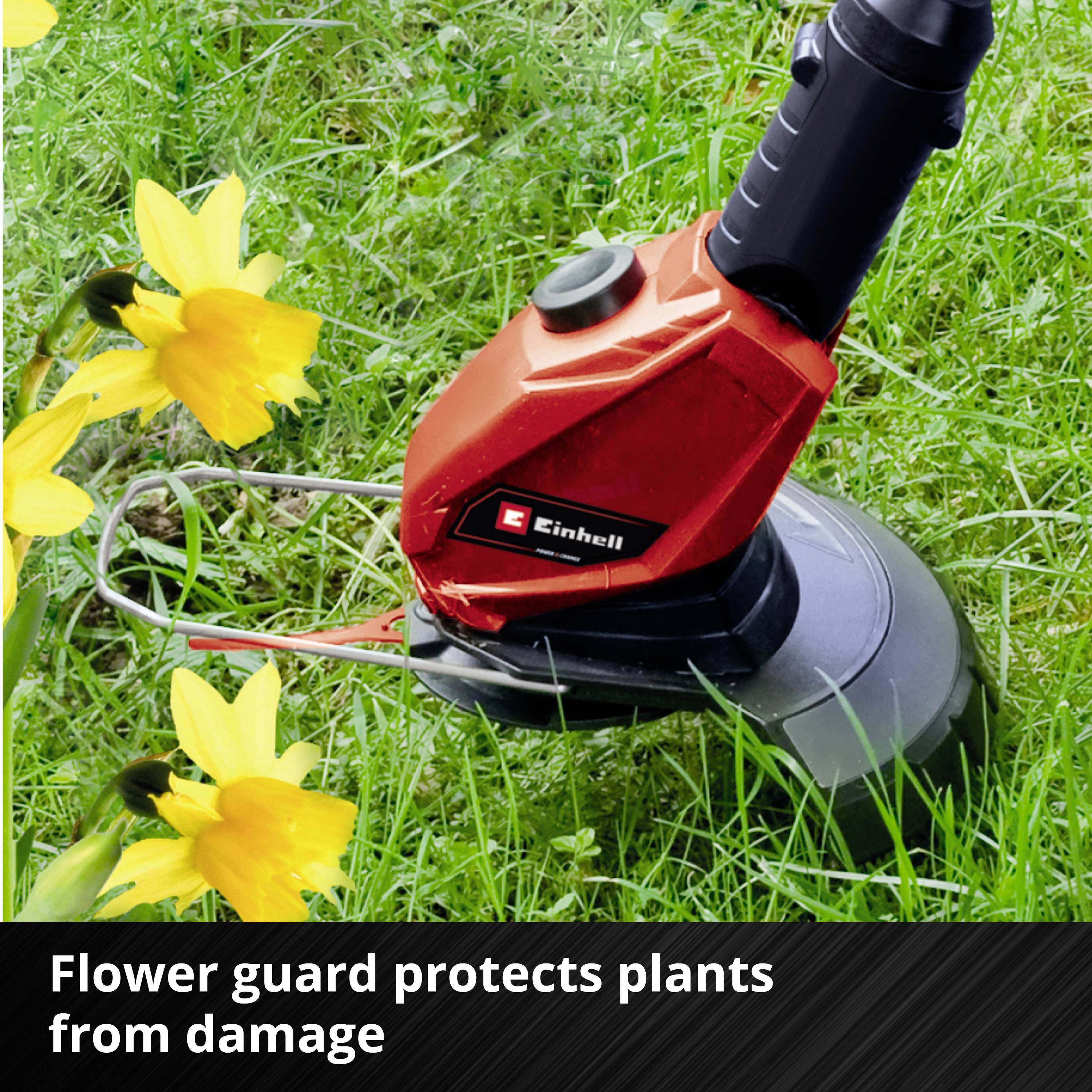 Tagliaerba rosso sull'erba verde con fiori gialli. Testo sotto: 'Flowerguard protegge le piante da danni'.