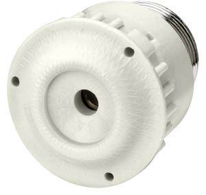 Un pezzo in plastica bianco di forma rotonda, con bordo scanalato e un'apertura centrale.