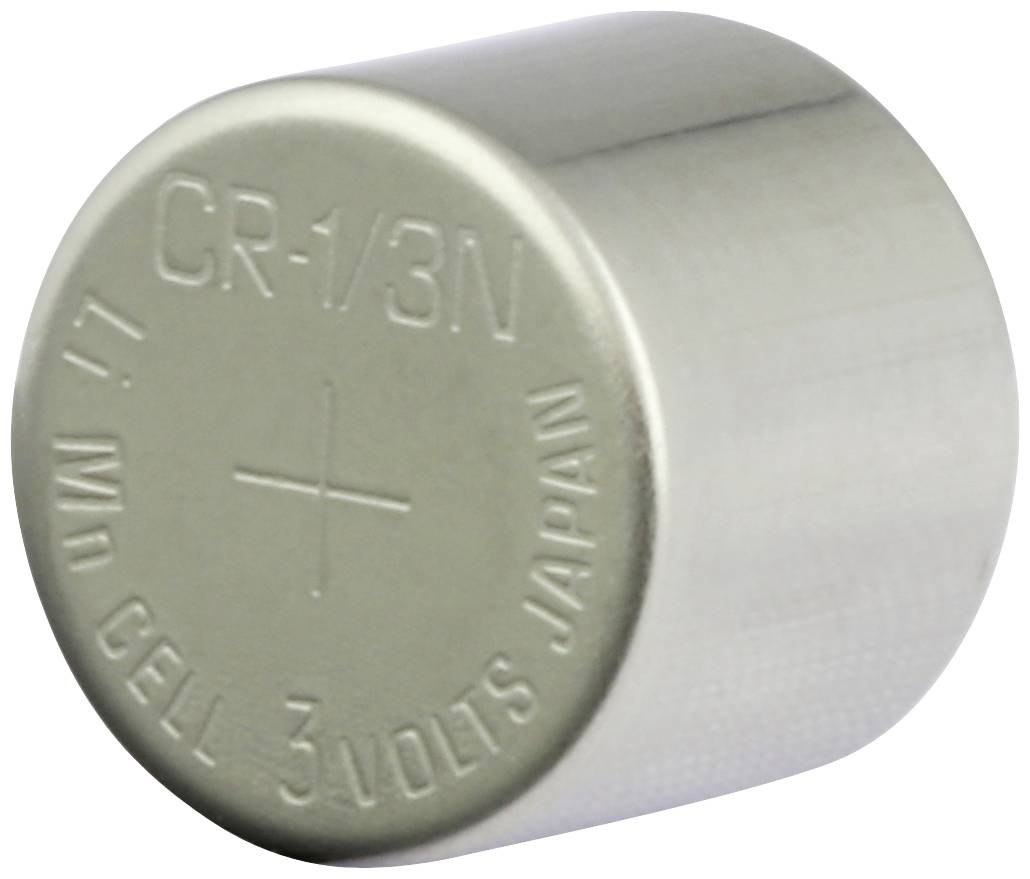 Cella a bottone in argento CR-1/3N con marcatura del polo positivo e incisione '3 Volt'.