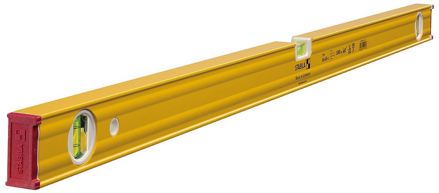 Un livello a bolla di colore giallo con due bolle, utilizzato per livellare superfici. Lo sfondo è neutro.