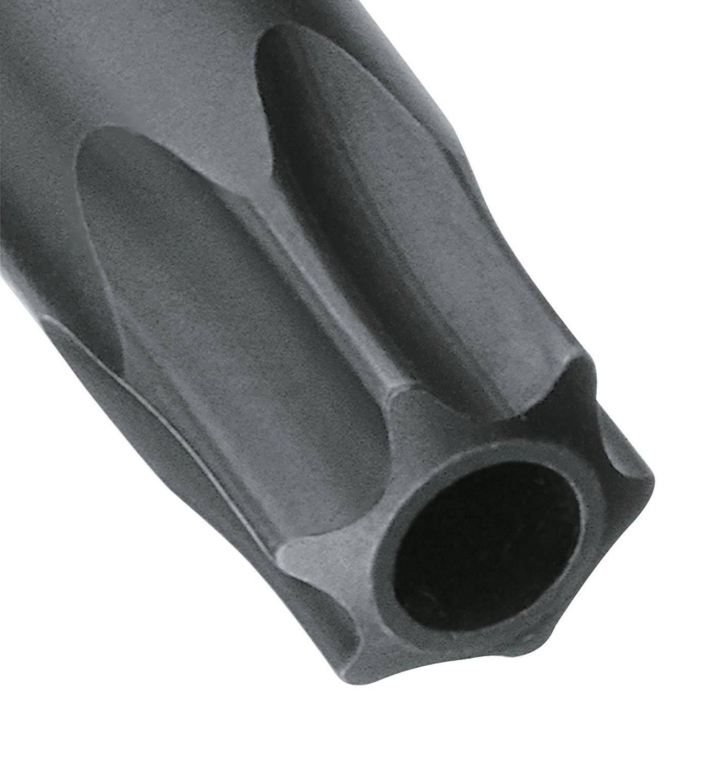 Un tubo nero e scanalato con un'apertura circolare, presumibilmente parte di un utensile o di un componente meccanico, mostrato in primo piano.