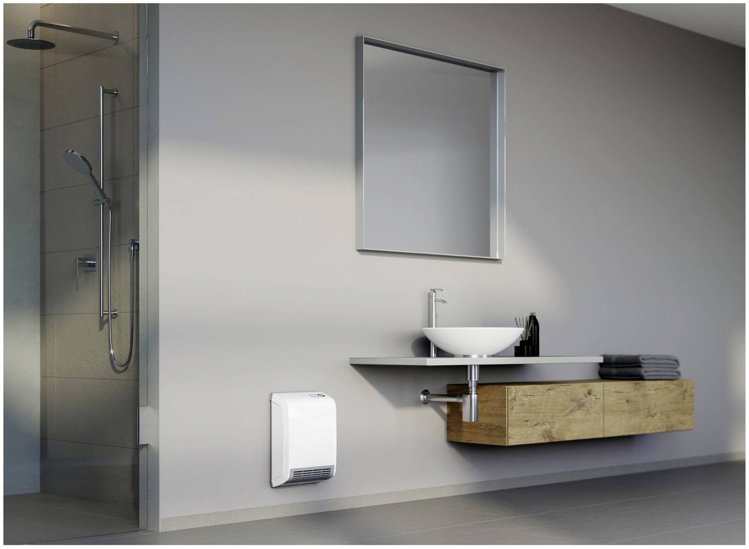 Bagno con lavabo, mobile sottolavabo in legno, sopra un grande specchio. A sinistra c'è una cabina doccia, e sulla parete è appeso un dispositivo di riscaldamento.