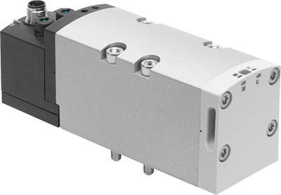 Una valvola pneumatica rettangolare con involucro grigio e nero, dotata di diverse viti e raccordi sulla parte superiore.