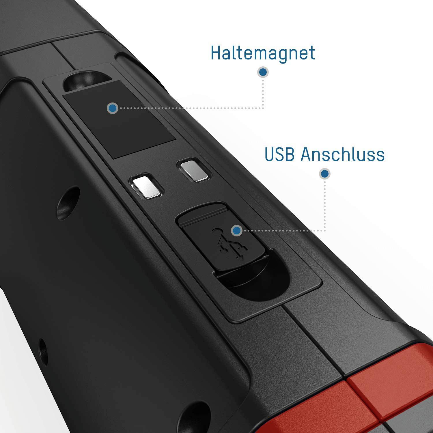 Primo piano di un attrezzo nero con accento rosso, che mostra un magnete di fissaggio e una porta USB, con etichette in lingua tedesca.