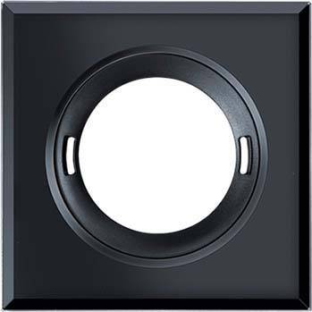 Un telaio nero con un ritaglio tondo, adatto per prese elettriche o interruttori. Design essenziale e moderno per interni.