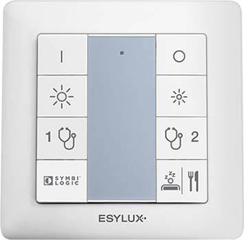 Un interruttore della luce con sei tasti. In alto a sinistra un 'I', in alto a destra un 'O'. Sotto simboli per la luminosità e la selezione della scena ('1', '2'). In basso simboli per 'Symbi Logic', modalità sonno e modalità pranzo.