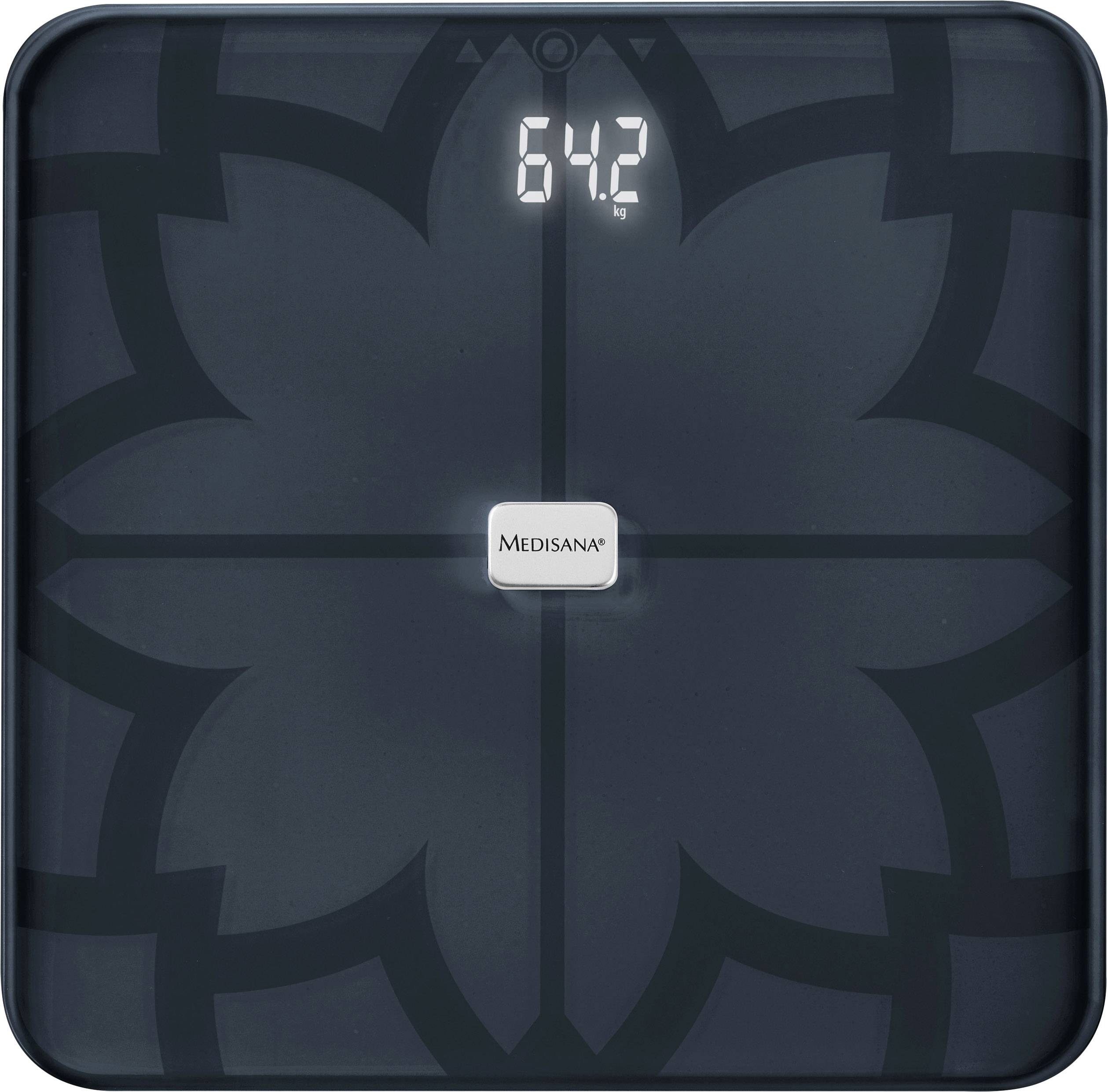 Bilancia digitale per persone che mostra un peso di 64,2 kg. Sullo sfondo un motivo floreale scuro.