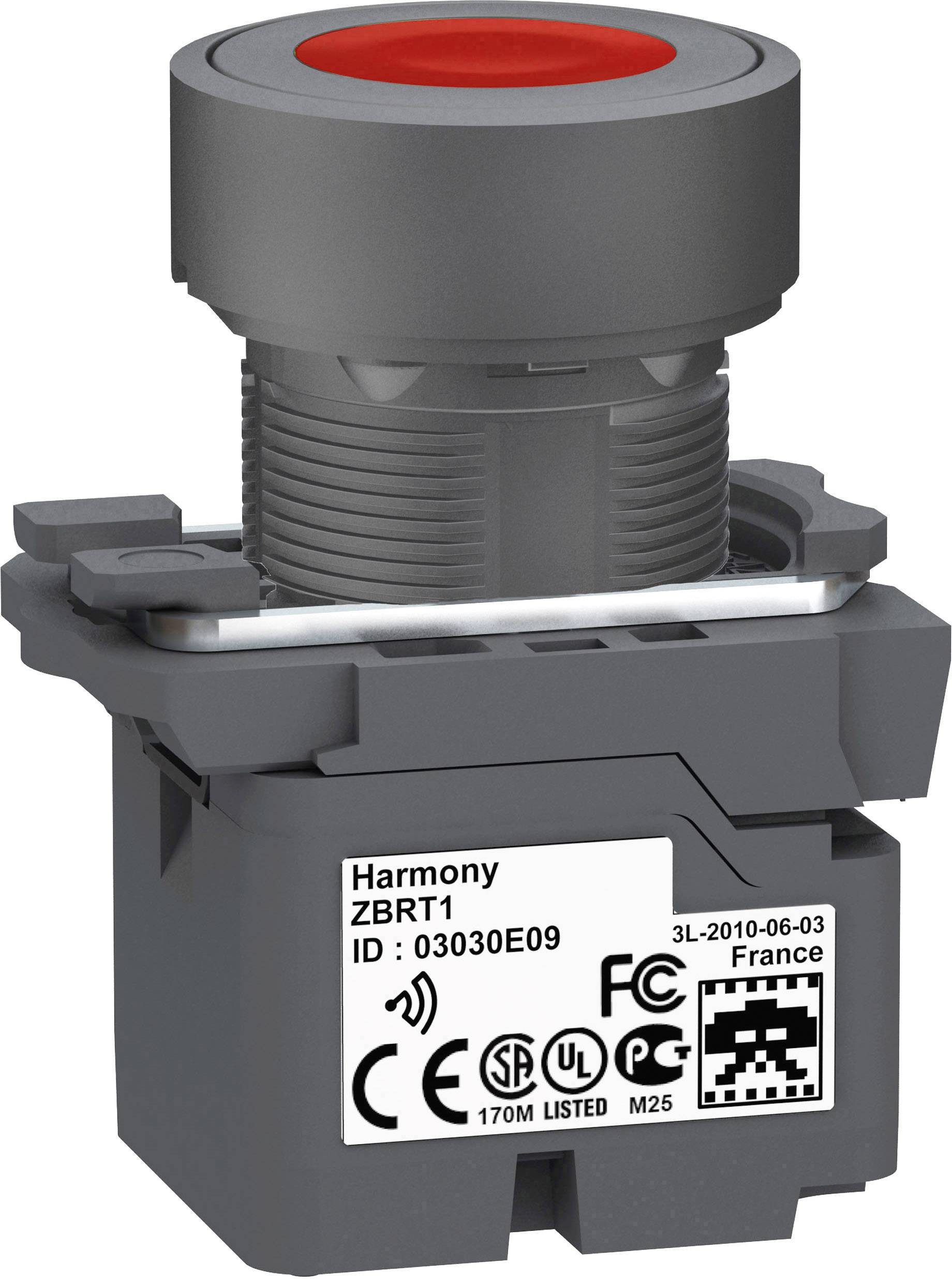 Un pulsante industriale grigio e rosso con marcatura 'Harmony ZBRT1', con certificazioni CE e UL visibili.