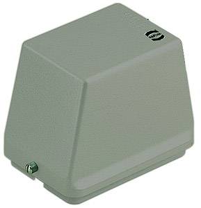 Un involucro metallico grigio-verde, quadrato con angoli arrotondati e una vite sul fondo; probabilmente un dispositivo tecnico.