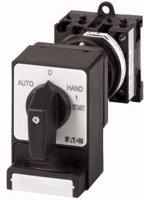 Interruttore con tre impostazioni: 'AUTO', 'MANO', '0'. Interruttore su 'AUTO', a destra una leva per l'avviamento. Dispositivo di Eaton.