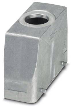 Un pezzo di metallo argentato a forma di parallelepipedo con un'apertura rotonda in alto. Potrebbe essere parte di un dispositivo meccanico o industriale.