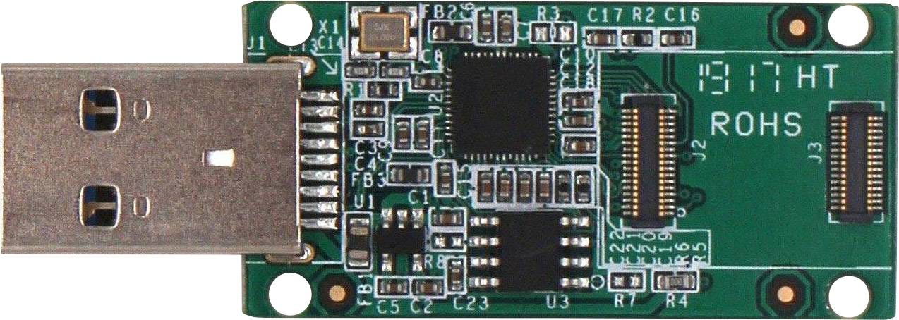 Dispositivo USB con una piccola scheda verde su cui sono visibili componenti elettronici e connessioni. I segni riportano 'ROHS'.