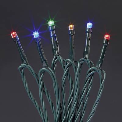 Diversi LED colorati su cavi verdi brillano in un ambiente buio.