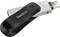 Chiavetta USB con logo 'SanDisk', metallo grigio e plastica nera. Il dispositivo ha un connettore Lightning integrato.