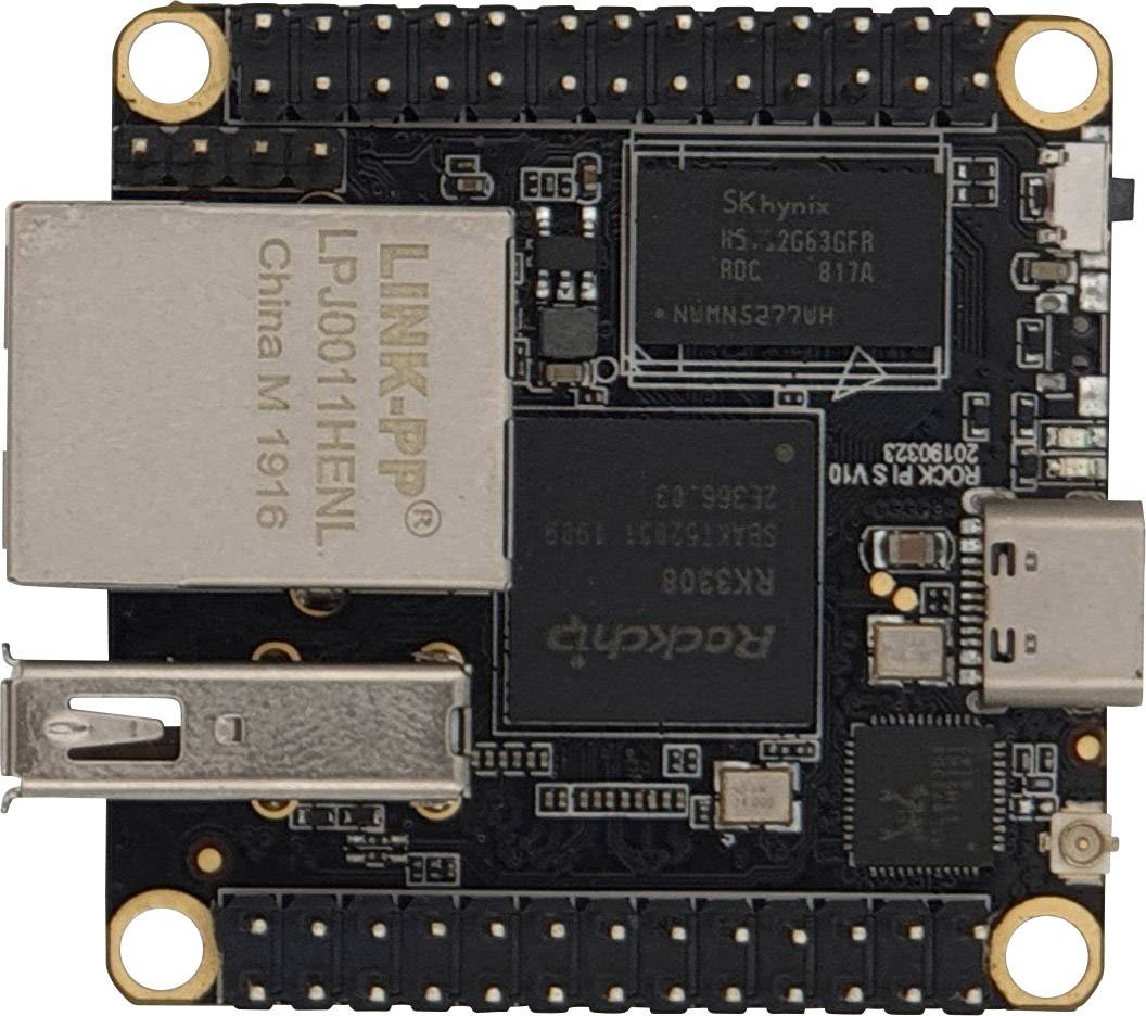 Una piccola scheda elettronica con una porta USB e diversi chip, tra cui uno grande, etichettato con 'Rockchip'.