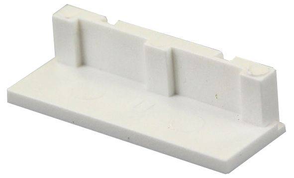 Un pezzo di plastica bianco con tre segmenti rialzati. Assomiglia a un supporto o a un componente destinato a uno scopo specifico.