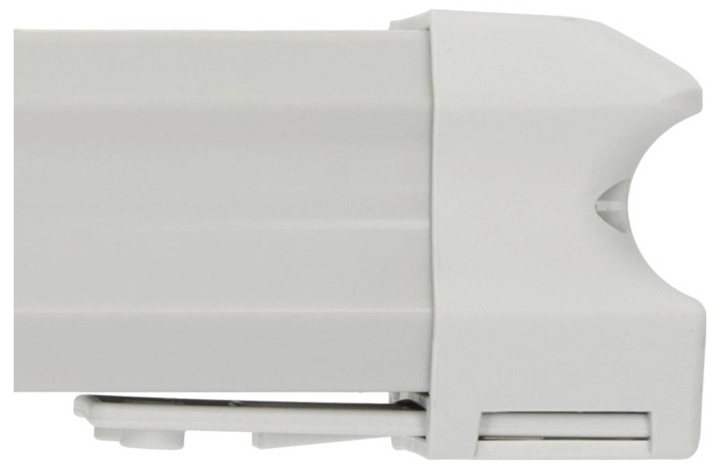 Primo piano di un dispositivo bianco in plastica montato a parete o di un contenitore con un'apertura laterale arrotondata e una fessura simile a una presa d'aria nella parte inferiore.