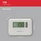 Un termostato da parete bianco con schermo digitale indica 21°C. Misure in millimetri: profondità 62, larghezza 136, altezza 98. Marca: Honeywell.