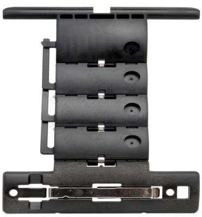Parte in plastica nera, rettangolare, con diversi segmenti mobili e fori per il montaggio. Probabilmente un componente tecnico di ricambio.