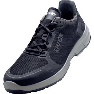 Scarpa antinfortunistica nera con suola grigia e logo 'uvex' sul lato, adatta per ambienti di lavoro industriali.