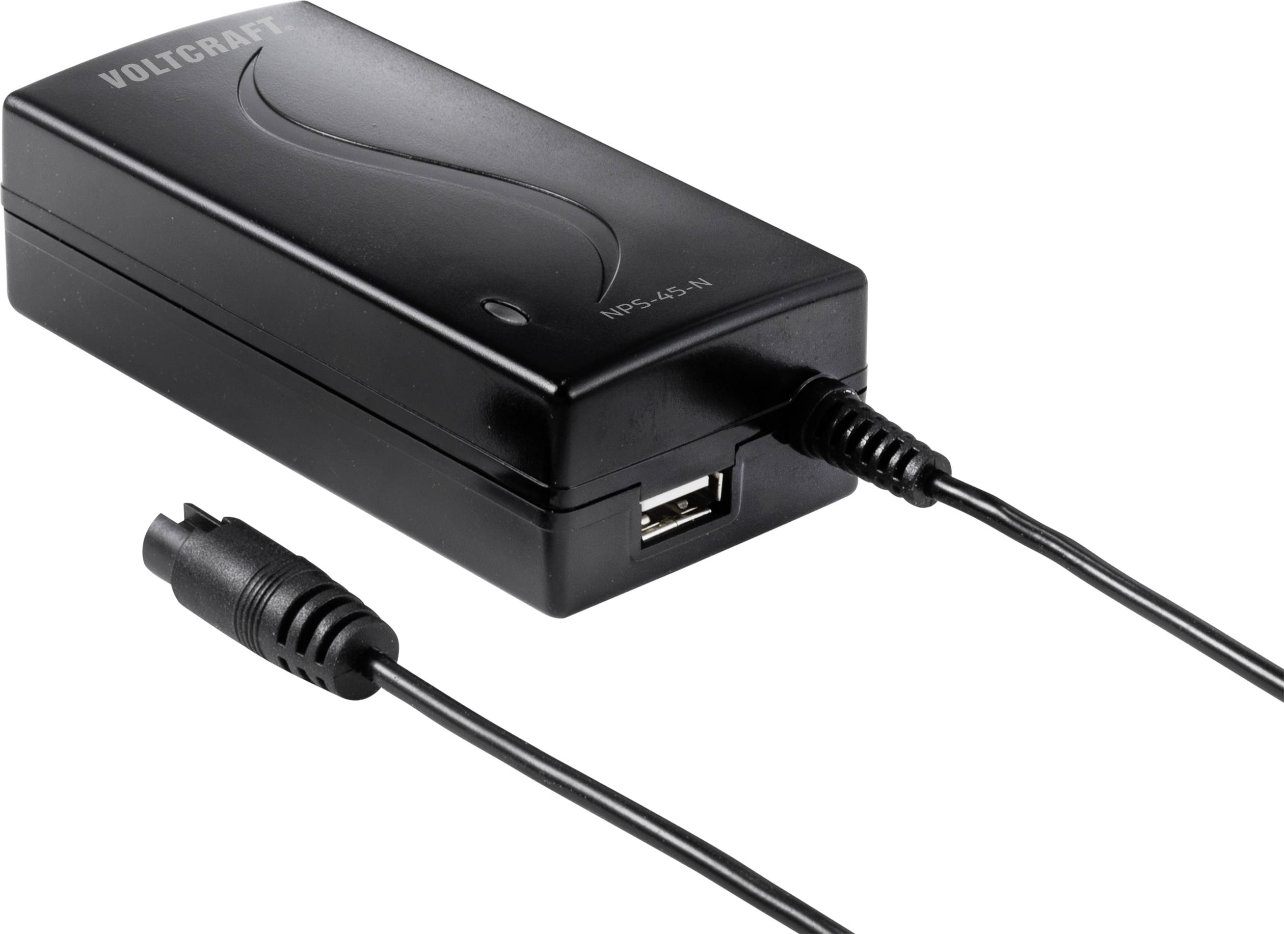 Alimentatore nero con porta USB e cavo. Scritta 'Voltcraft' visibile.