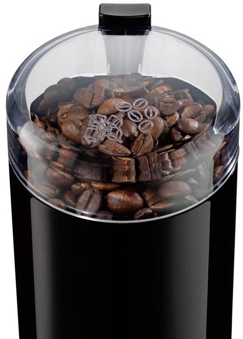 Macinacaffè nero con coperchio trasparente, riempito con chicchi di caffè. Il coperchio mostra piccoli simboli di chicchi di caffè.