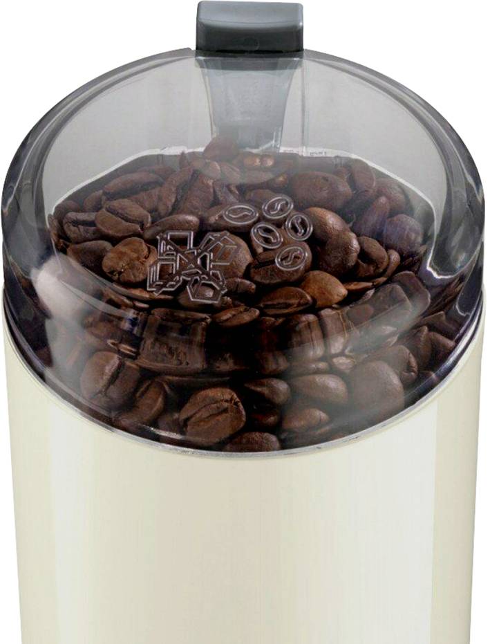 Macinacaffè con coperchio trasparente, riempito con chicchi di caffè.