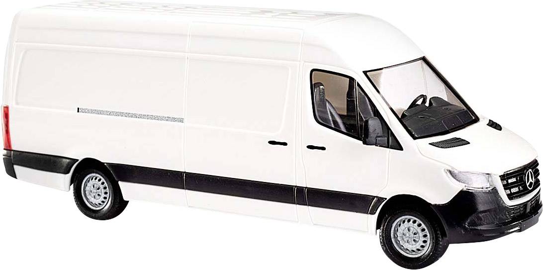 Un furgone bianco con dettagli neri, fotografato di lato. Il veicolo ha una carrozzeria alta ed è adatto per trasporti.