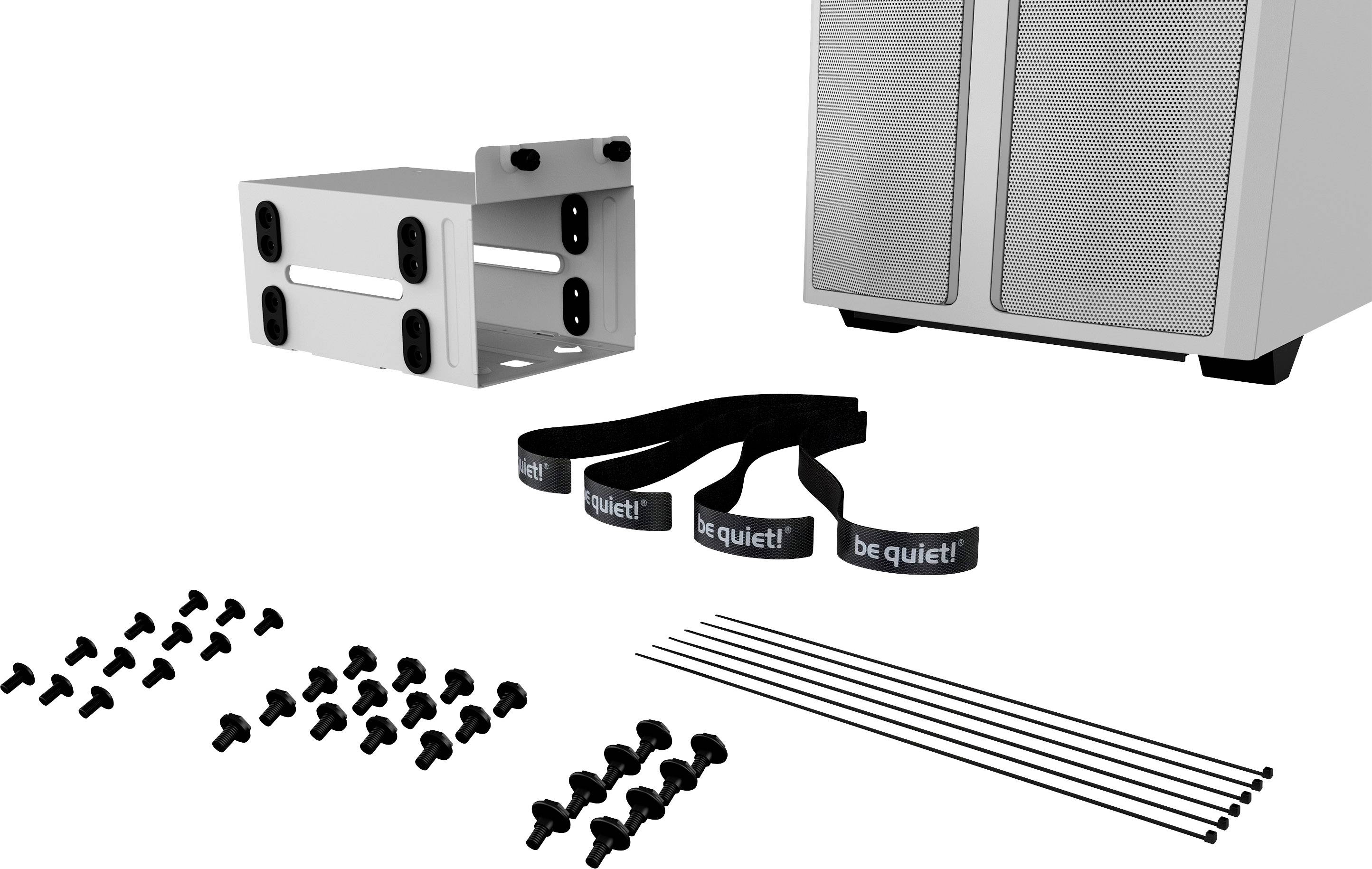Accessori di montaggio per un case per computer: viti, fascette, supporto e un componente del case.