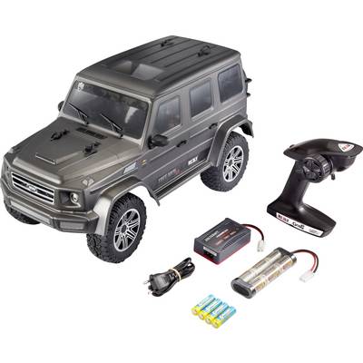 Modello di fuoristrada radiocomandato in grigio con telecomando, caricabatterie e batterie. Ideale per hobby o modellismo.