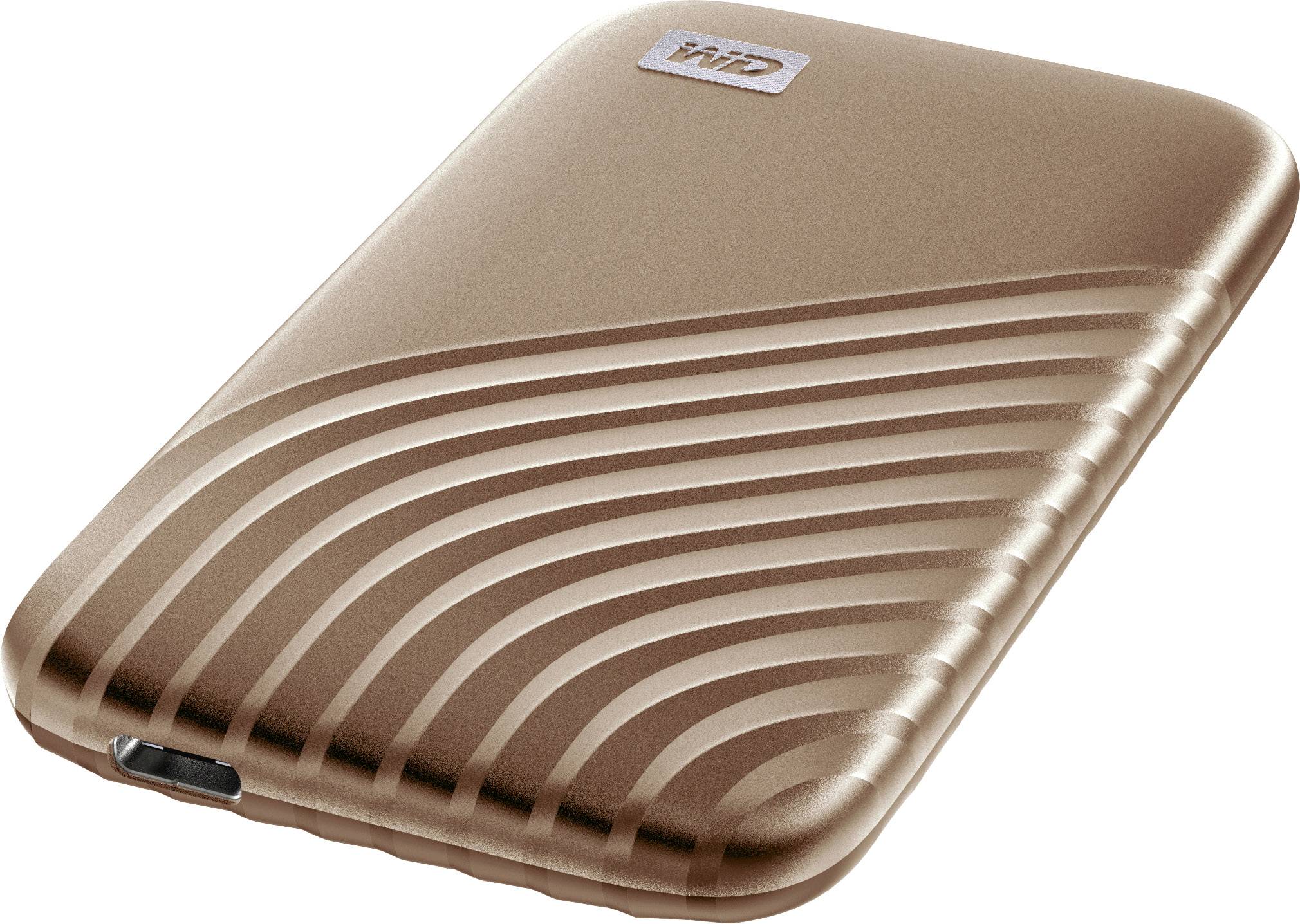 Un hard disk esterno color bronzo con design ondulato e una porta USB sul lato inferiore.