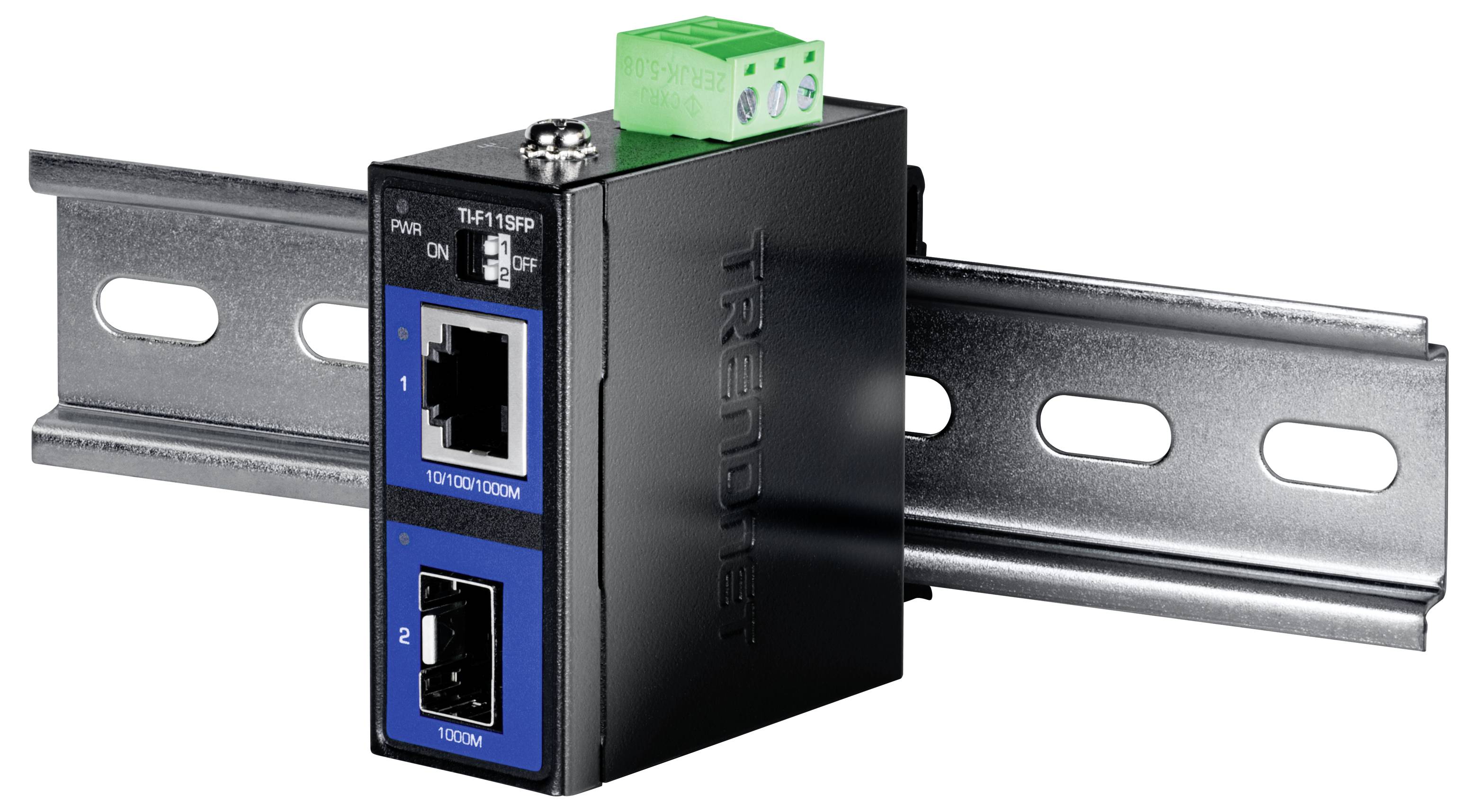 Switch Ethernet industriale per guida DIN con due porte frontali e morsettiera verde montata su una guida metallica.