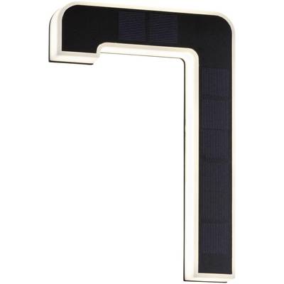 Struttura nera a forma di angolo con illuminazione LED e pannelli solari che rappresentano la forma del numero sette.