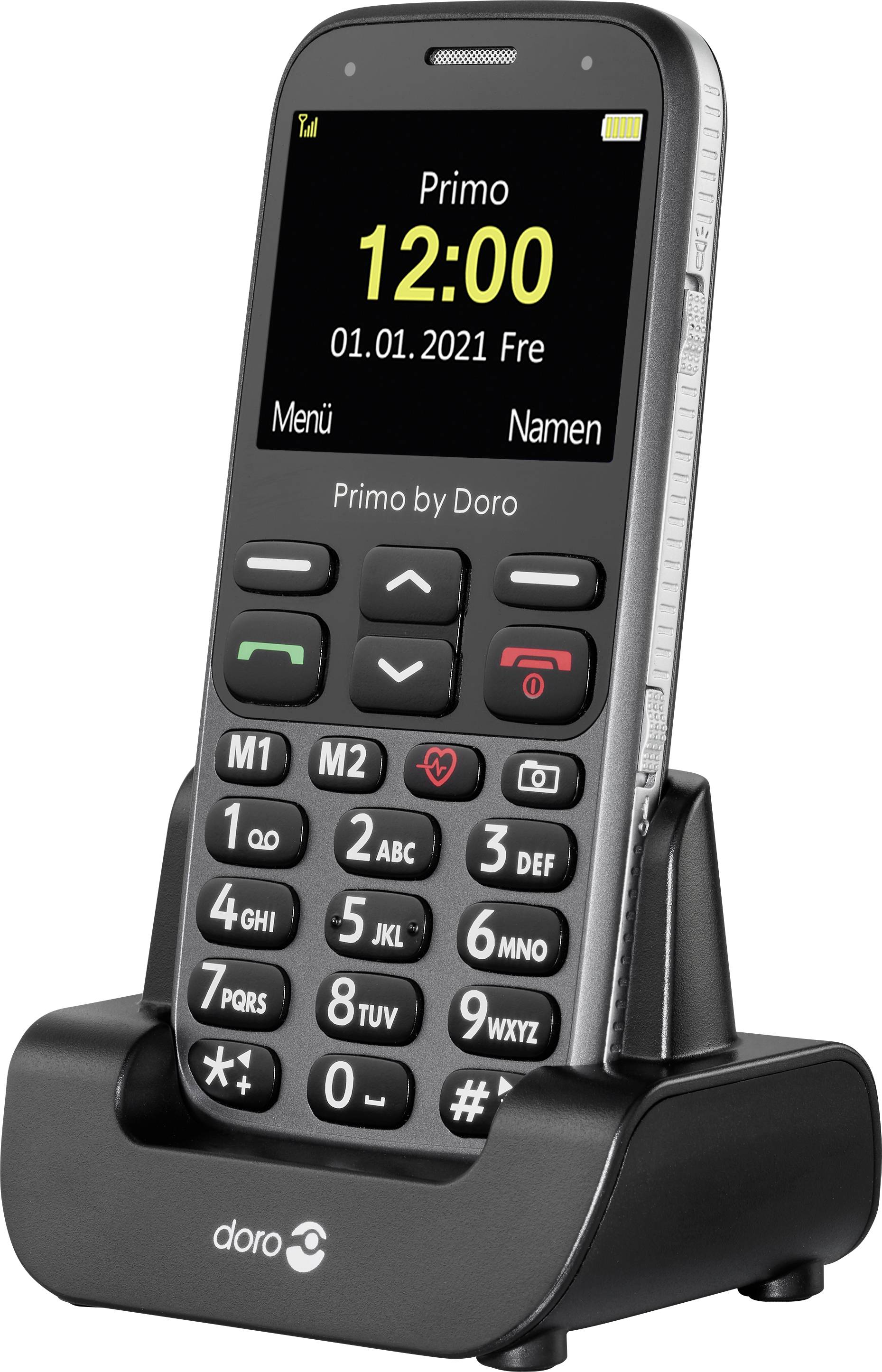 Un telefono cellulare con tasti grandi, è posizionato in una stazione di ricarica. Sul display sono visibili l'ora '12:00' e la data '01.01.2021'.