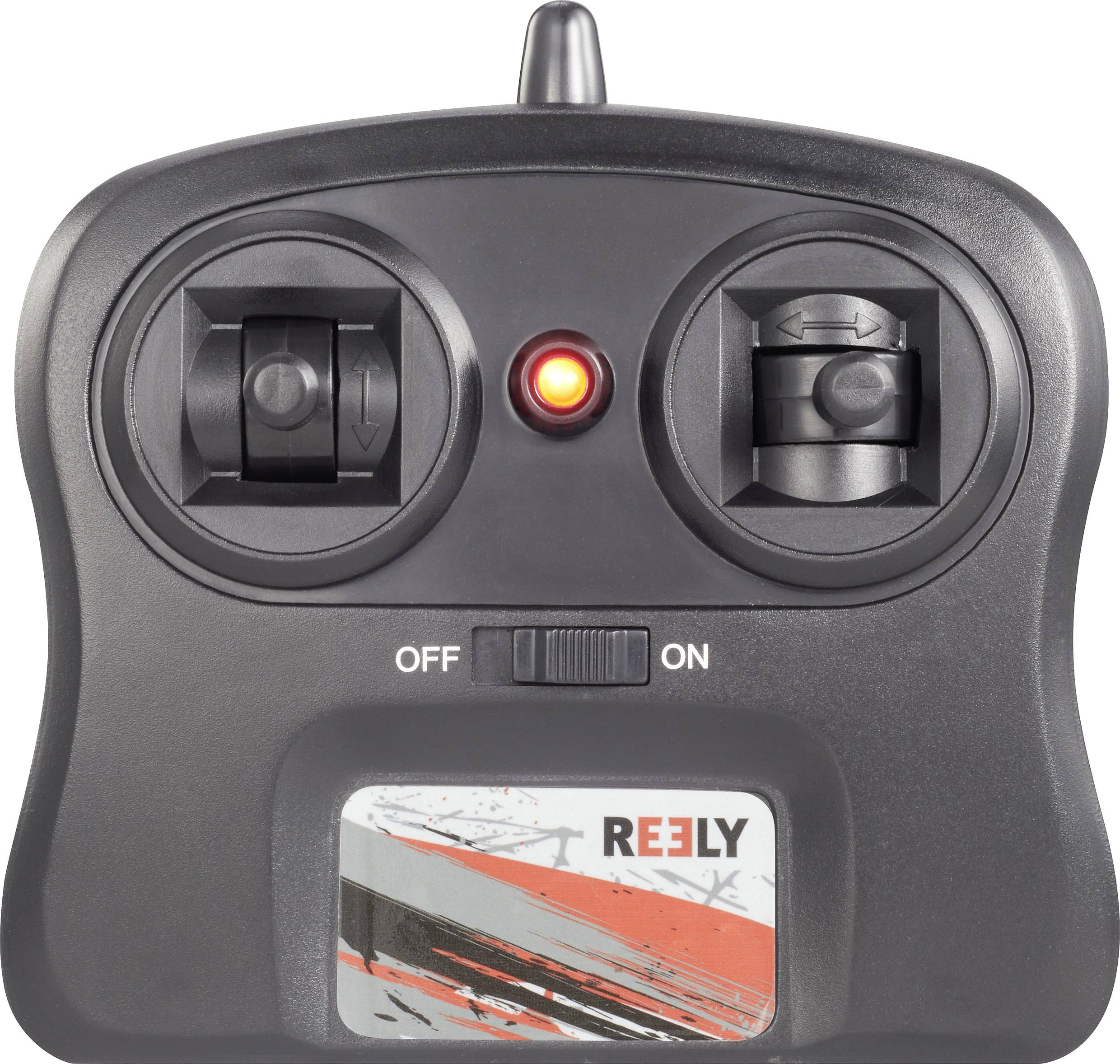 Un telecomando nero con due leve di comando e una luce rossa lampeggiante al centro. In basso, la scritta 'Reely'.