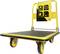 Carrello di piattaforma giallo con superficie nera, quattro ruote e maniglie. Contrassegnato con portata di 300 kg e dimensioni.