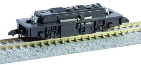 Un modello nero di un vagone ferroviario su un tratto di binario. Il vagone ha ruote dettagliate e strutture superficiali precise.