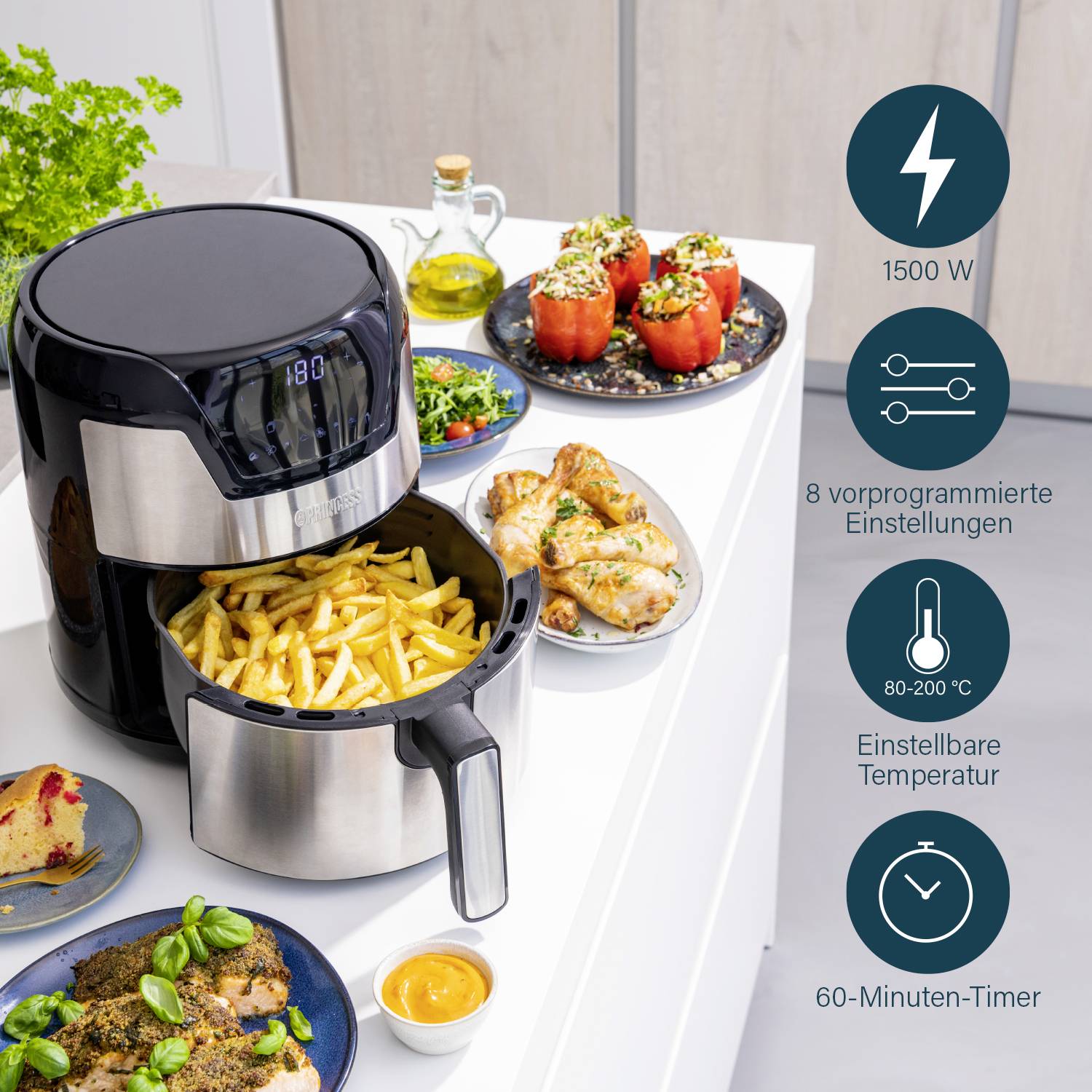 Friggitrice ad aria con 8 programmi e 1500 watt, mostra patatine fritte nel cestello, piatto con peperoni ripieni e pollo accanto.