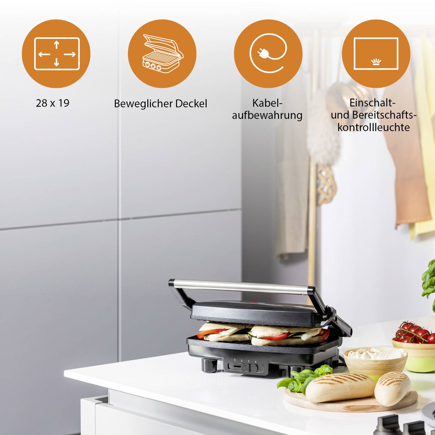 'Griglia elettrica con coperchio mobile e superficie di 28 x 19 cm, spazio per il cavo, indicatore di accensione e standby. Panini alla griglia.'