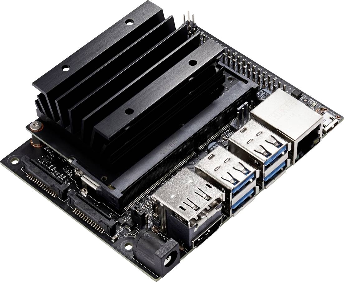 Scheda elettronica con più porte USB, connettore Ethernet e dissipatore di calore. Serve per collegare e controllare dispositivi elettronici.