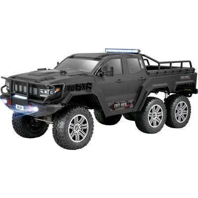 Un veicolo fuoristrada giocattolo nero a sei ruote, con alta luce da terra e telaio robusto, progettato per avventure off-road.