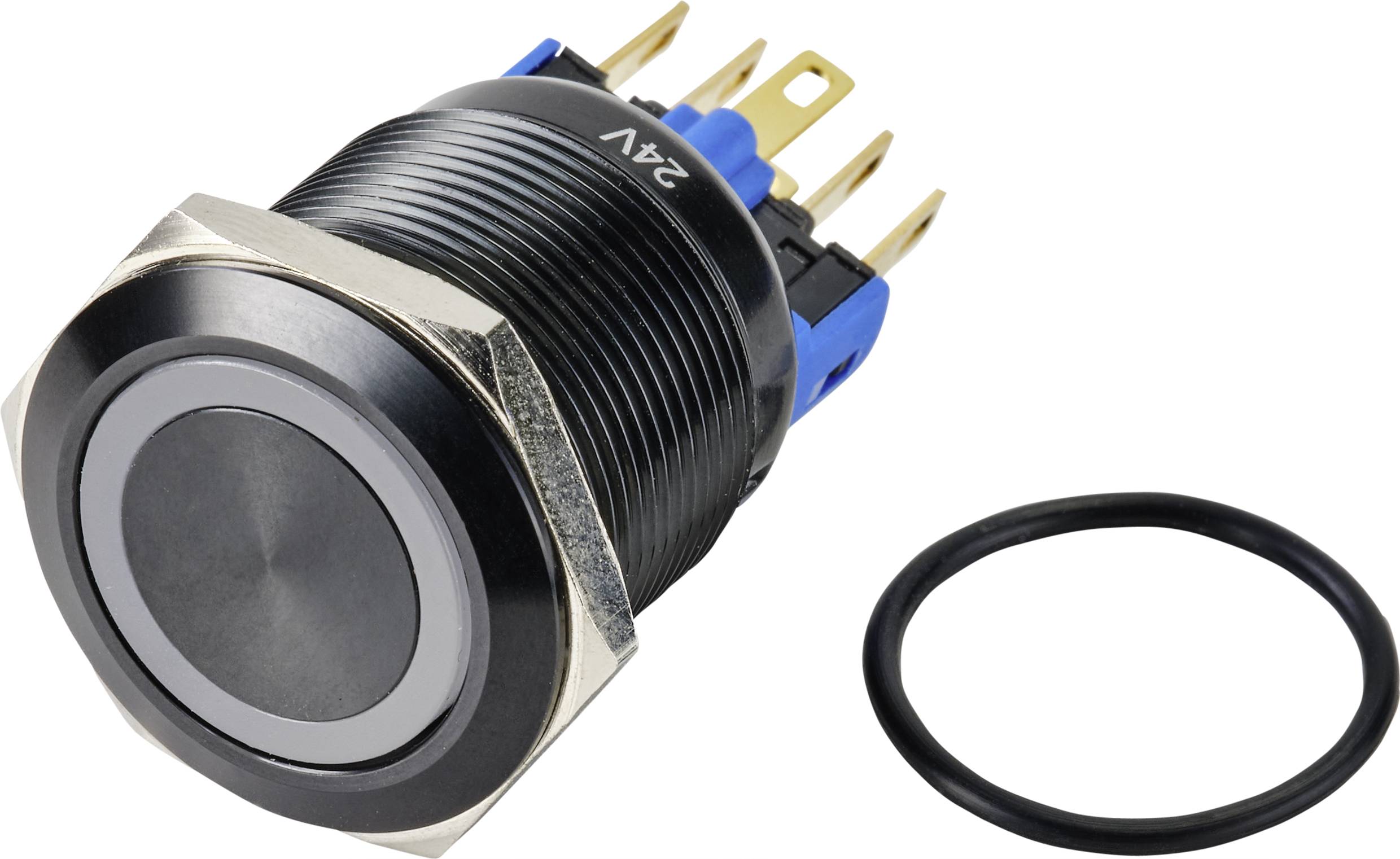 Un pulsante nero rotondo con marcatura 24V e diversi pin di connessione, accanto al quale è posto un anello di tenuta nero.