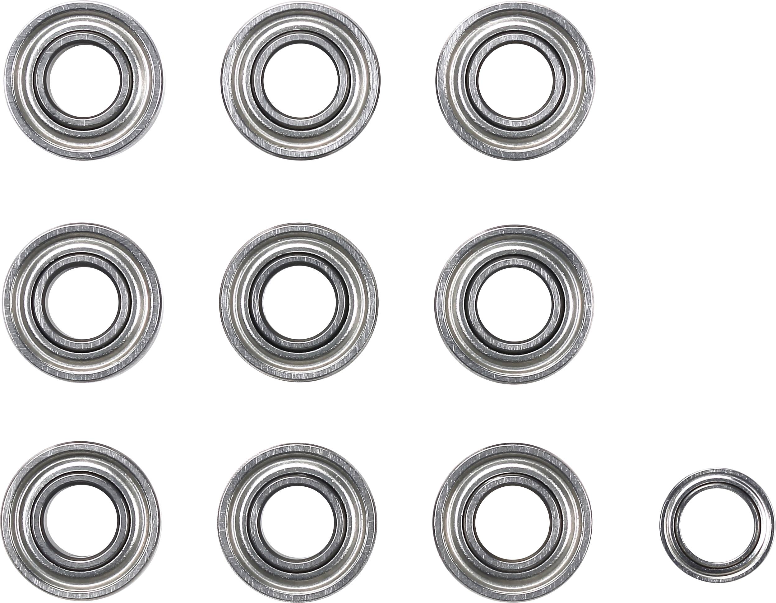Nove cuscinetti metallici circolari sono disposti su uno sfondo chiaro, con un cuscinetto leggermente più piccolo in basso a destra.