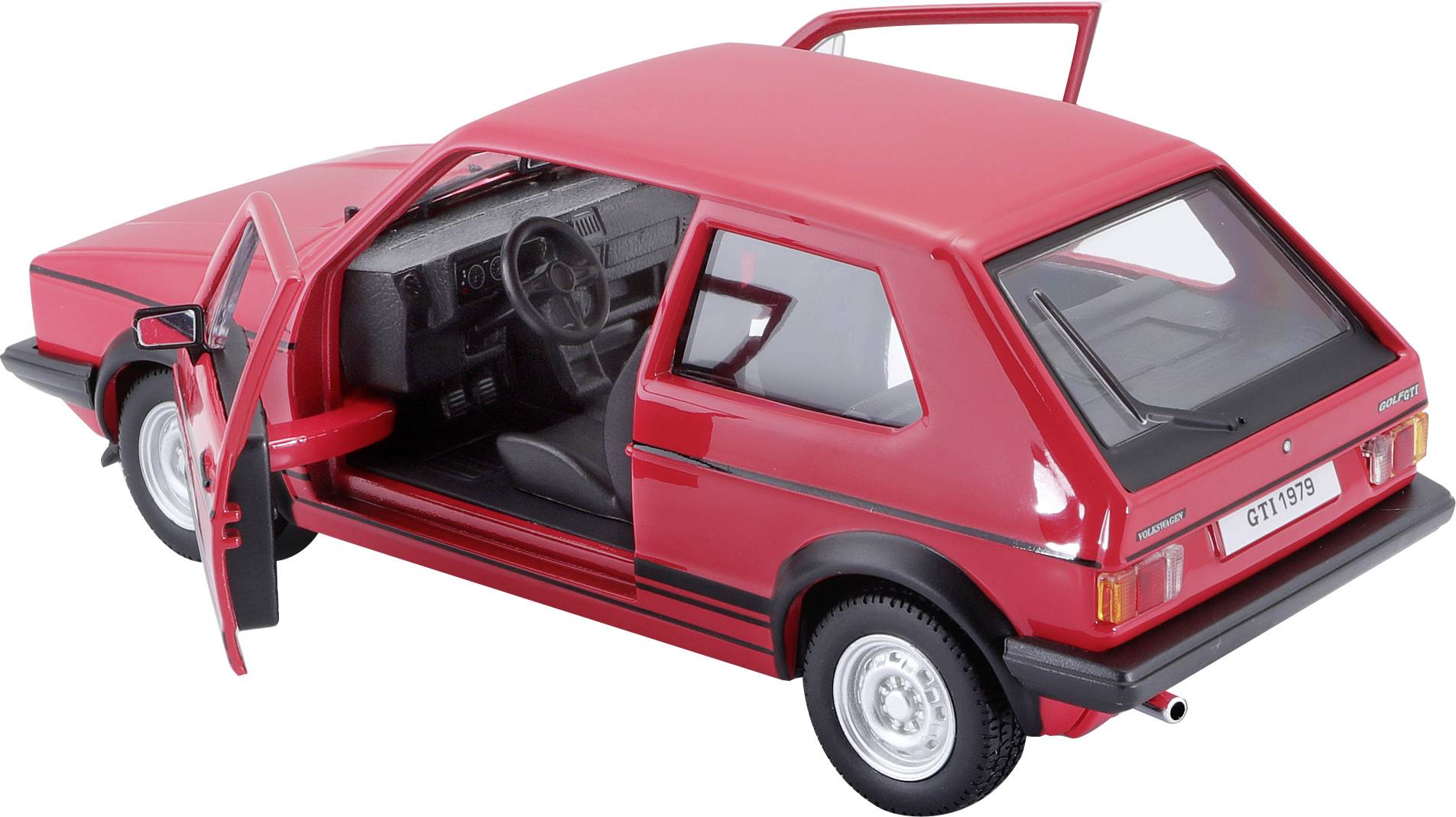 Auto modello rosso con portiere aperte, mostra l'interno e la plancia. Il veicolo è una compatta berlina a quattro porte.