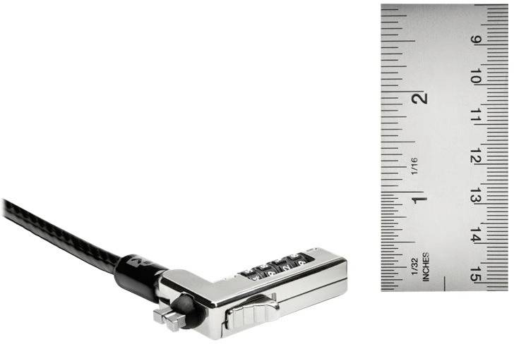 Un lucchetto argentato per laptop è posizionato accanto a un righello che mostra misure in pollici.