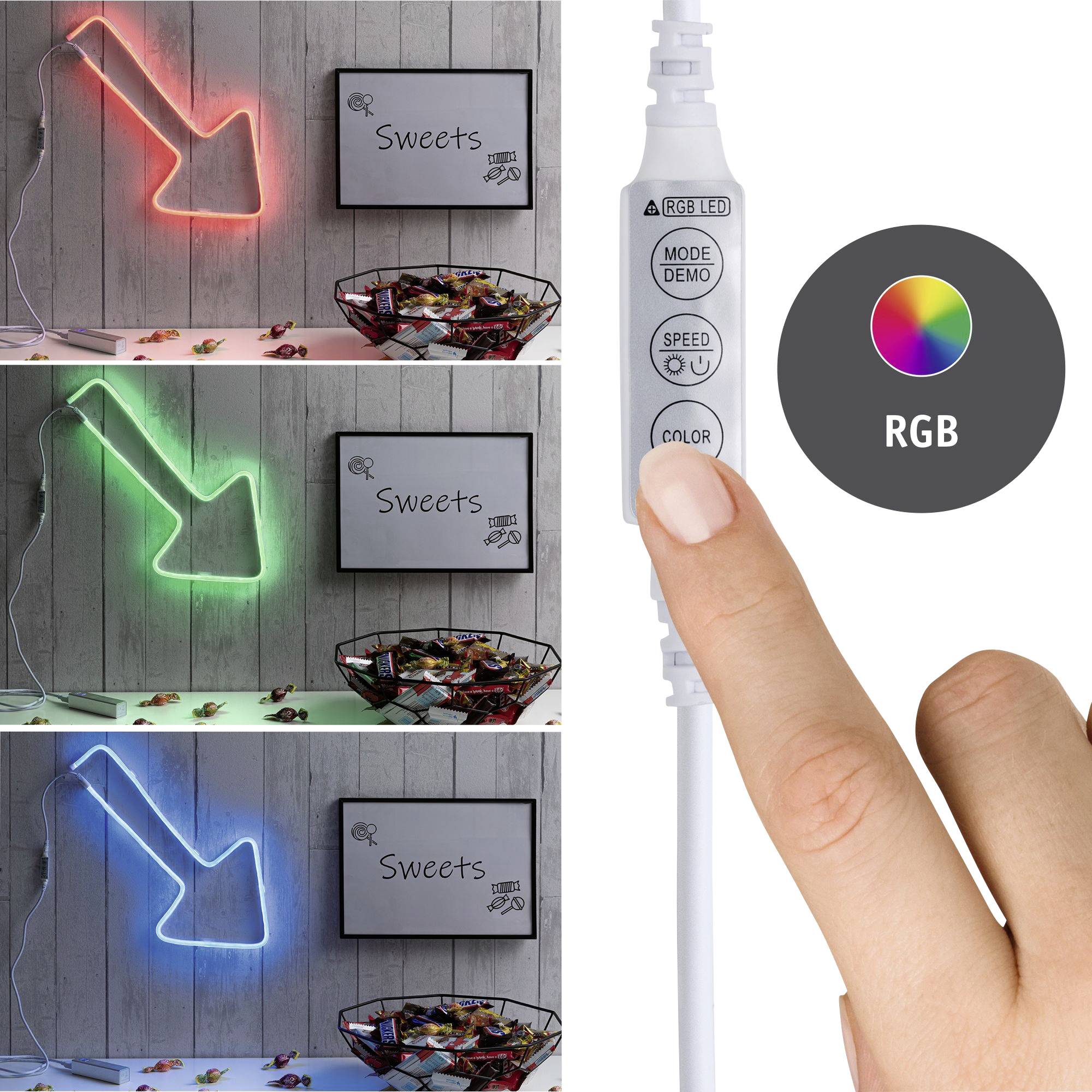 'Tre frecce LED in rosso, verde e blu puntano verso un cestino di caramelle. Un dito preme il pulsante 'COLOR' su un telecomando.'