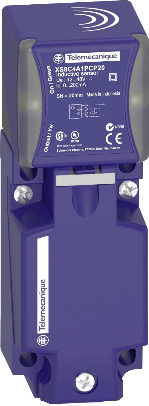 Un sensore di prossimità blu Telemecanique con numero di serie e identificazione del modello sulla parte superiore, montato su una superficie.