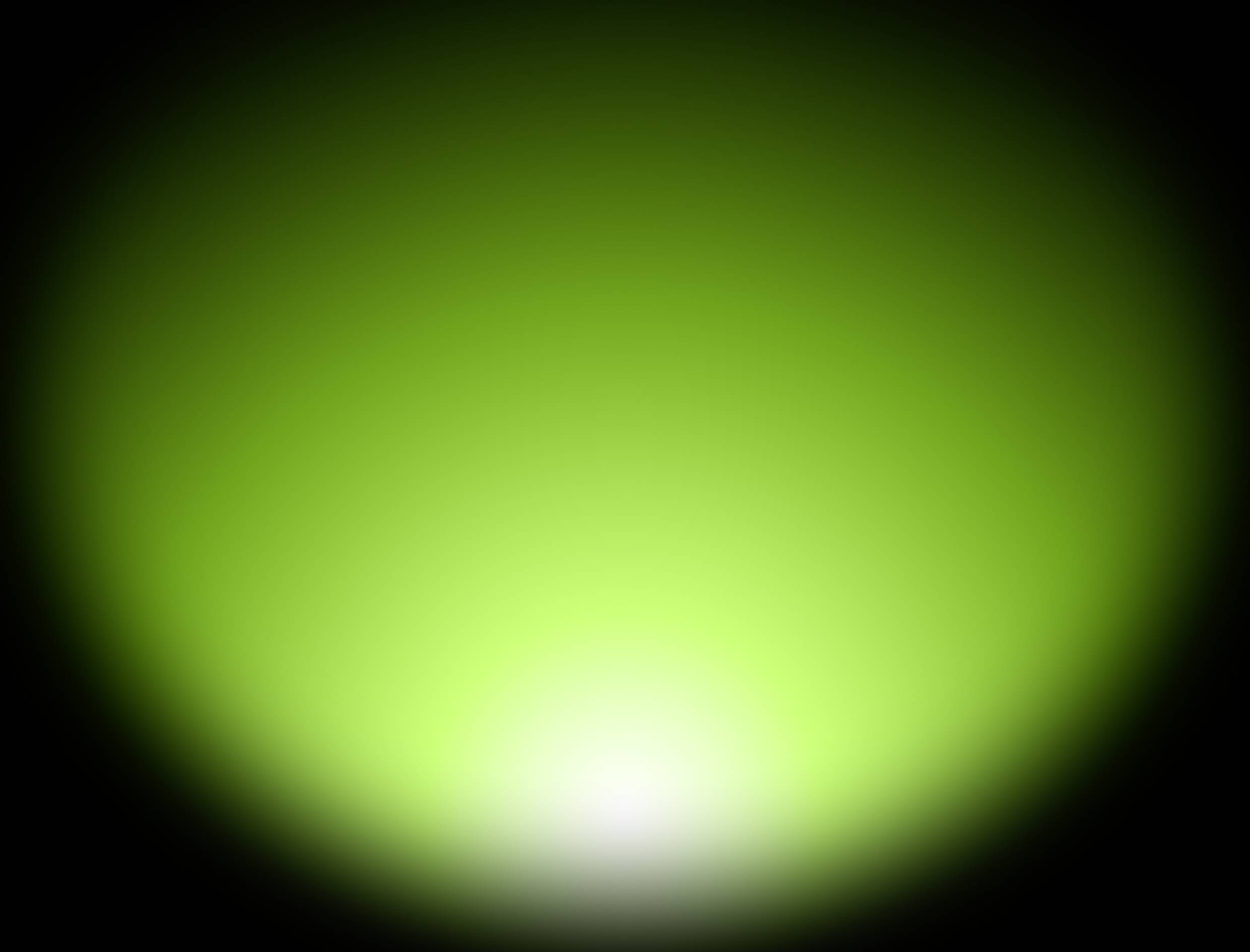 Un bagliore verde chiaro, diffuso, con un centro bianco su sfondo nero, che crea un'atmosfera suggestiva.