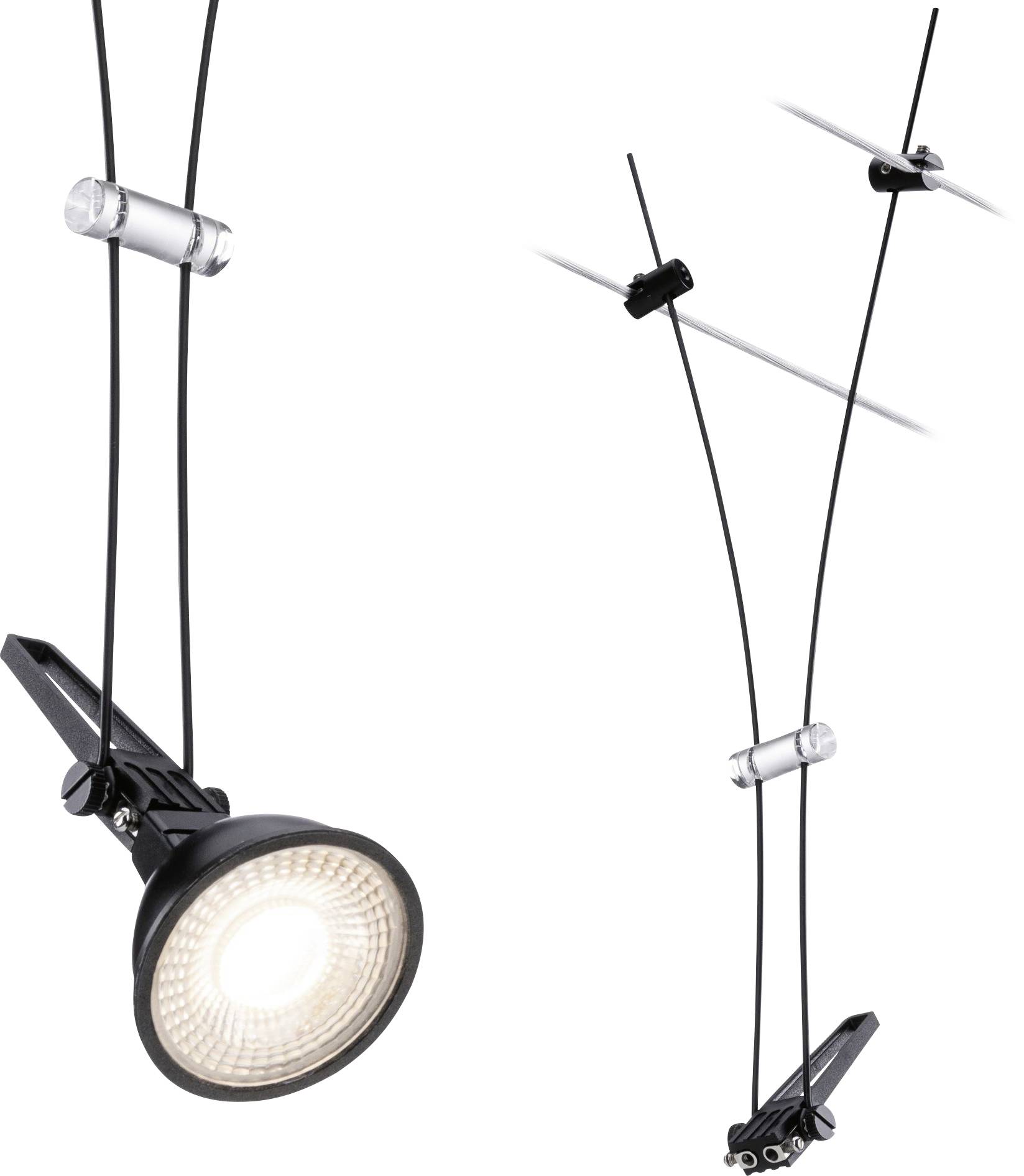 Proiettore da soffitto nero con sospensione a cavo, incorniciato in morsetti metallici, che illumina intensamente. I cavi sono fissati in supporti trasparenti.